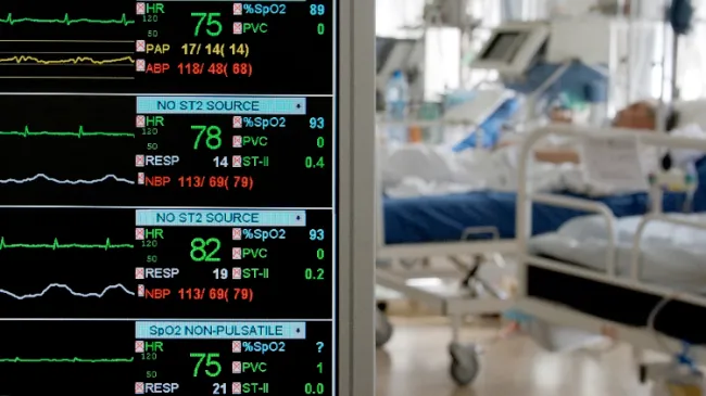 patient in ICU with monitors